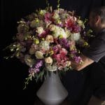Walter Vermeulen holding a wedding flower arrangement