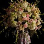anne kornman holding a wedding flower arrangement