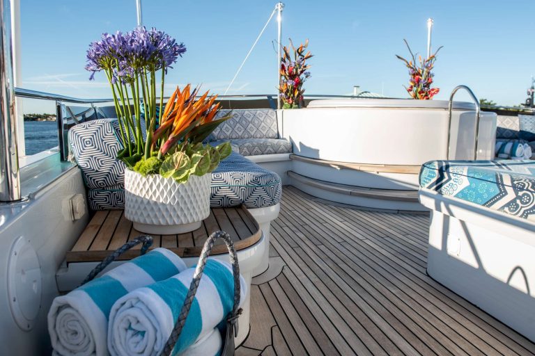 flower arrangements on the deck and pool of a yacht