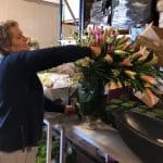 florist making a large pink lily bouquet