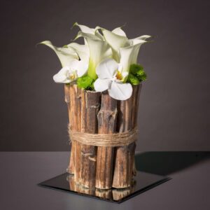 Orchid wedding flower arrangement with calla lilies