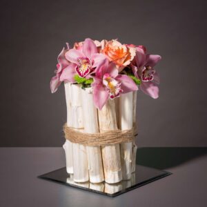 pink orchid wedding flower arrangement with roses